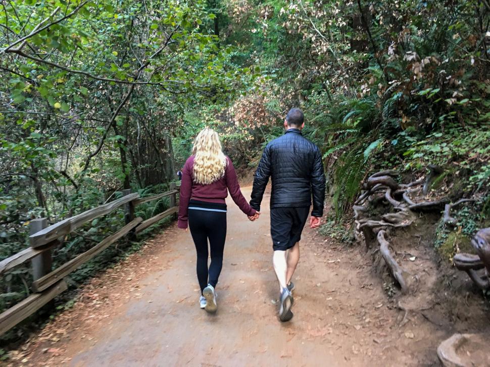 a couple walking in nature practicing self-care