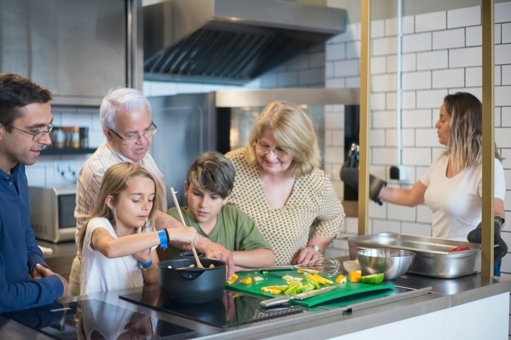 grandparents-children-and-parents-cooking